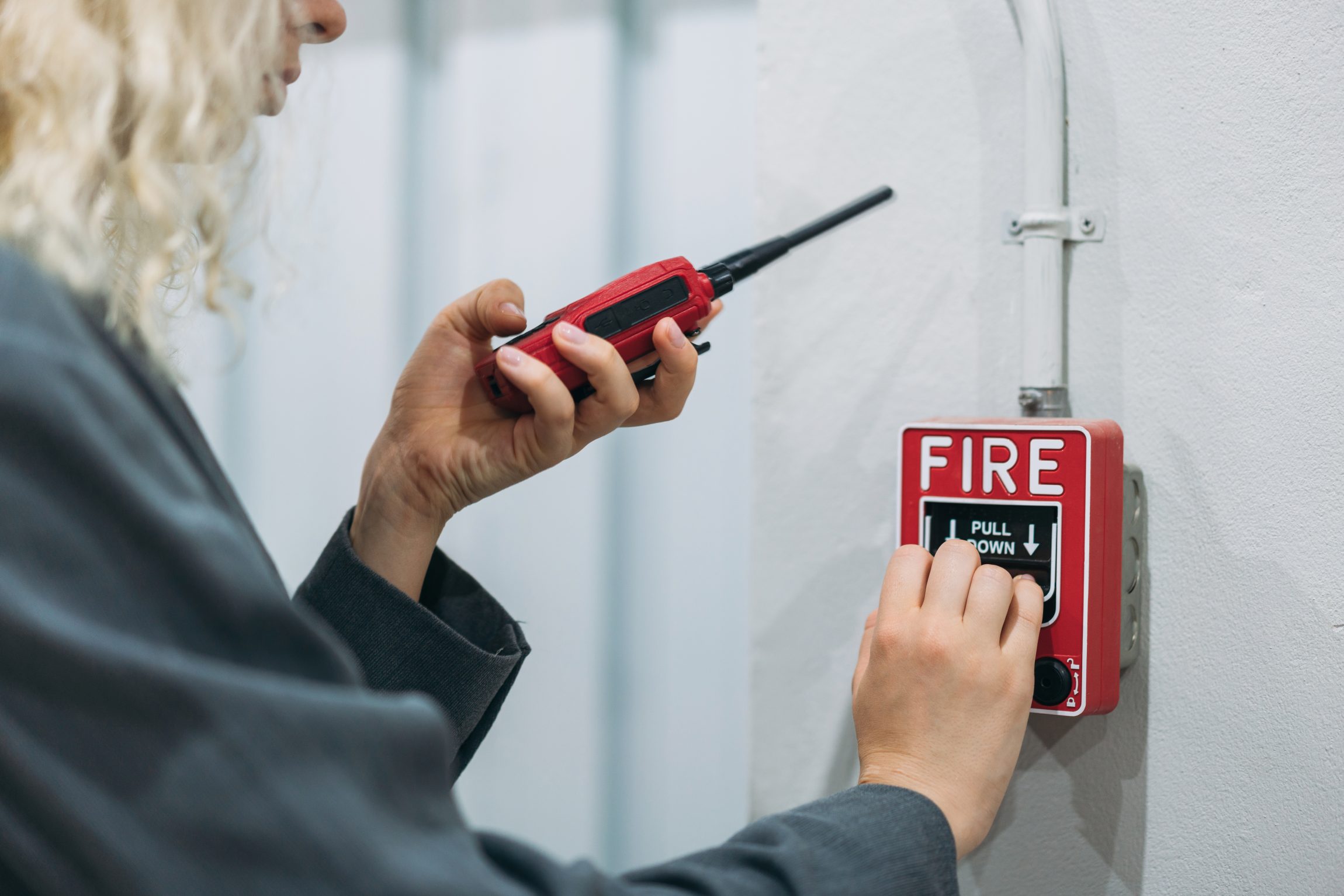 Warehouse workers use talkie of an emergency in a factory worker.